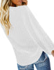 Back view of model wearing white long sleeves swiss dot button down tie-front top