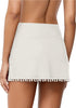 Back view of model wearing white tulip hem tassels mid-waist ruched swim skirt