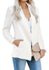 Angled shot of model wearing white open-front side pockets blazer