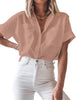 Front view of model wearing blush short cuffed sleeves pockets button-up top