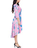 Side view of model wearing pink tie-dye high-low plus size wrap skater dress