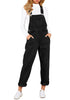 Front view of model wearing black cuffed denim boyfriend overall