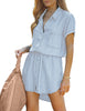 Front view of model wearing sky blue elastic waist curved hem button down denim shirt dress