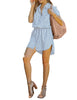 Full front view of model wearing sky blue elastic waist curved hem button down denim shirt dress