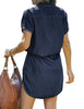 Back view of model wearing dark blue elastic waist curved hem button down denim shirt dress