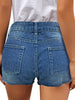Back view of model wearing deep blue ripped mid-waist raw hem denim shorts