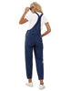 Back view of model wearing dark blue cuffed denim bib jeans overalls