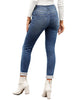 Back view of model wearing light blue triple button fleece-lined skinny denim jeans