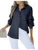 Front view of model wearing dark blue puff sleeves button-down top