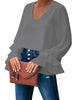 Model wearing grey ruffle cuff long sleeves V-neck blouse