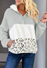 Front view of model wearing grey colorblock half-zip hooded fleece pullover