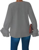 Back view of model wearing grey ruffle cuff long sleeves V-neck blouse