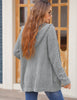 Back view of model wearing light grey button down melange waffle knit hooded cardigan