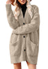Front view of model wearing beige button down drop shoulders oversized knit cardigan