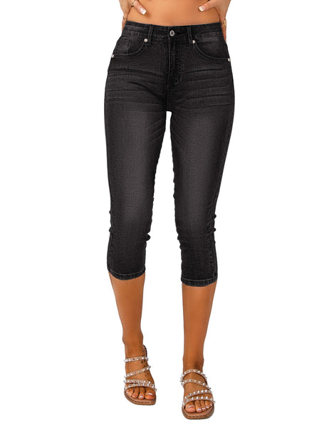 Model wearing black below knee skinny fit jeans shorts