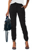 Front view of model wearing black elastic-waist welt pockets denim jogger pants