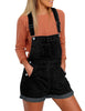 Front view of model wearing black rolled hem shorts denim bib overall