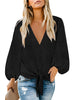 Front view of model wearing black long sleeves swiss dot button down tie-front top