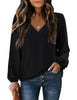 Front view of model wearing black V-neckline bishop sleeves loose fit women's top