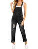 Front view of model wearing black cuffed hem ripped bib denim overall jumpsuit