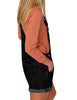 Side view of model wearing black rolled hem shorts denim bib overall