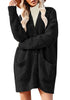 Front view of model wearing black button down drop shoulders oversized knit cardigan