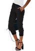 Side view of model wearing black elastic-waist welt pockets denim jogger pants
