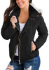 Model poses wearing black faux fur hooded zip up quilted jacket