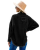 Back view of model wearing black drop shoulders contrast corduroy button-down jacket