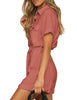 Side view of model wearing dark coral short sleeves button-down belted romper