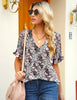 Front view of model wearing grey trim short sleeves printed V-neck button-down top