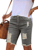 Side view of light grey frayed hem ripped denim bermuda shorts