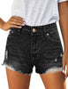 Front view of model wearing black ripped mid-waist raw hem denim shorts