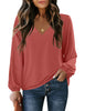 Front view of model wearing dark coral V-neckline bishop sleeves loose fit women's top