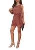 Full front view of model wearing dark coral sash belt keyhole-back sleeveless romper