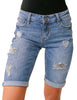 Front view of model wearing light blue women mid-waist frayed bermuda denim shorts