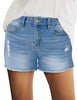 Model wearing light blue mid-waist raw hem distressed faded denim shorts