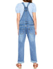 Back view of model wearing light blue cuffed hem distressed girls' denim jeans overall