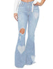 Model poses wearing light blue mid-waist ripped heart flared denim