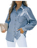 Posing model wearing light blue puff sleeves button-down top