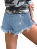 Back view of model wearing light blue fringed hem distressed denim shorts