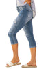 Side view of model wearing light blue below knee cropped skinny denim jeans