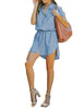 Full front view of model wearing light blue elastic waist curved hem button down denim shirt dress