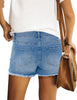 Back view of model wearing light blue mid-waist raw hem distressed faded denim shorts