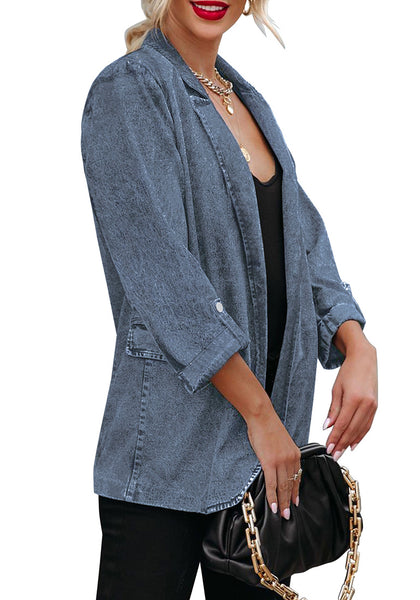 Side view of model wearing blue lapel collar flap pockets open-front denim blazer