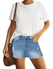 Front view of model wearing light blue mid-waist raw hem distressed faded denim shorts