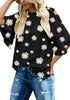 Model poses wearing black trumpet sleeves keyhole-back daisy printed blouse