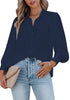 Front view of model wearing navy blue lantern sleeves button-down pleated chiffon top