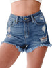Font view of model wearing deep blue high-waist frayed raw hem ripped denim shorts