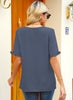 Back view of model wearing steel blue ruffle trim short sleeves V-neck button-down top